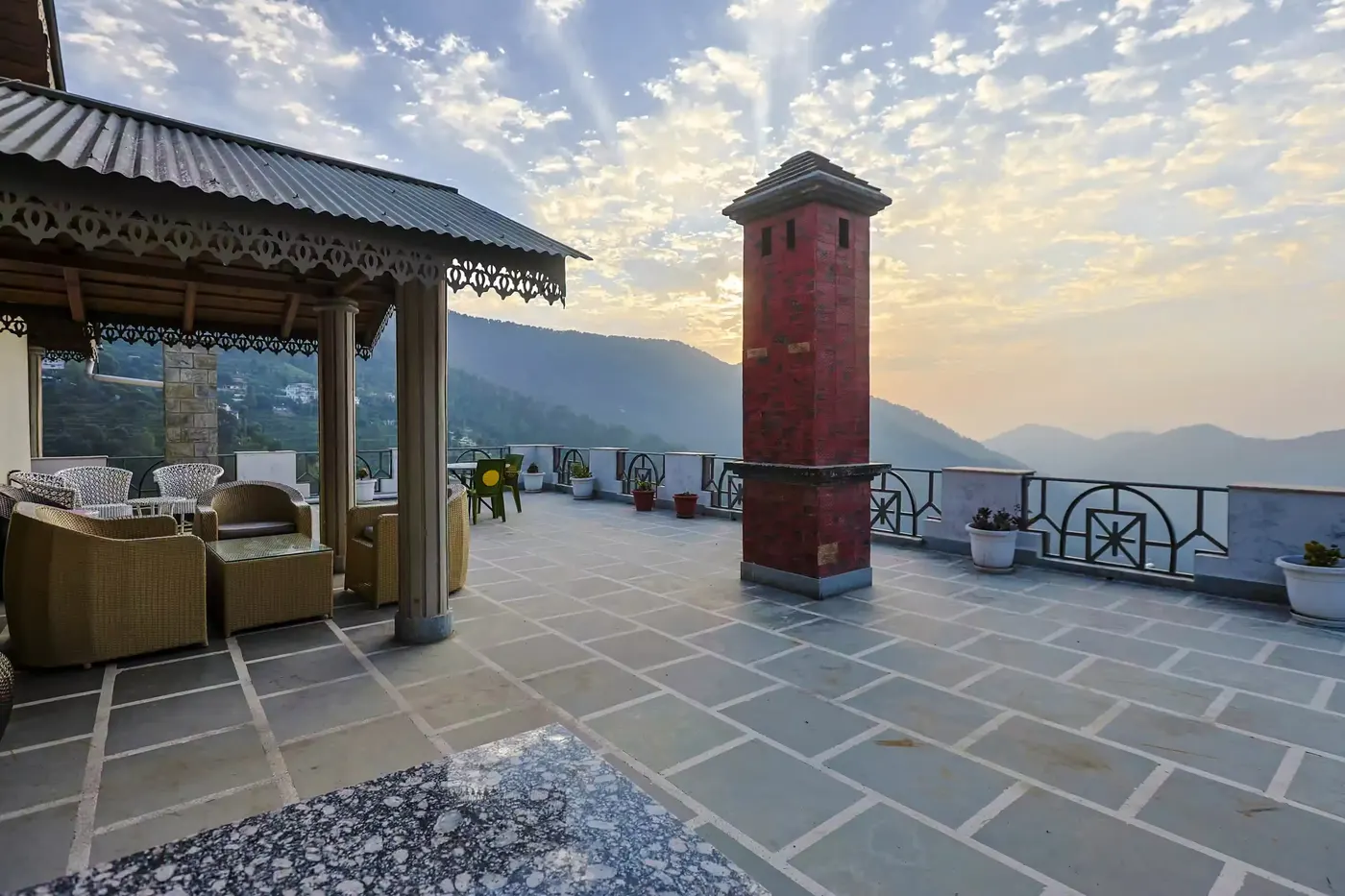 Whispering Pines Resort luxury 4-star mountain hotel exterior overlooking Himalayan snow peaks in Mukteshwar