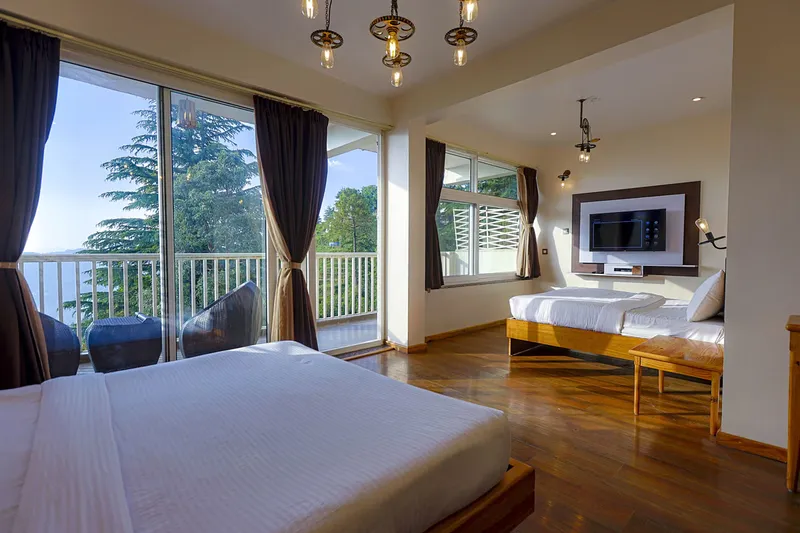 Cozy interior bedroom of Private Villa — The Ultimate Family Resort Experience Near Nainital at Whispering Pines Resort Mukteshwar, Uttarakhand